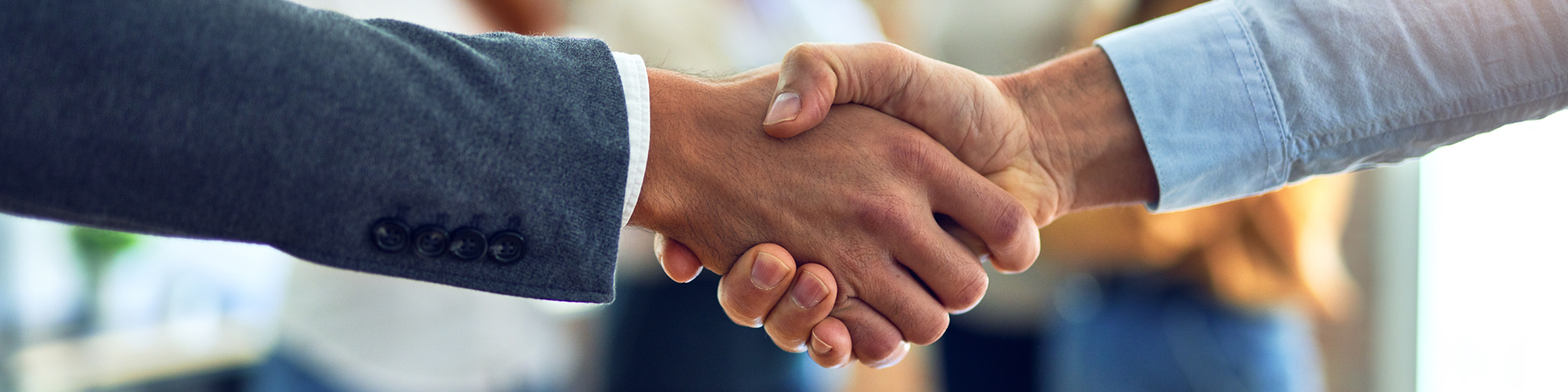 Group of business workers standing together shaking hands at the office Chair at local Dentist practice